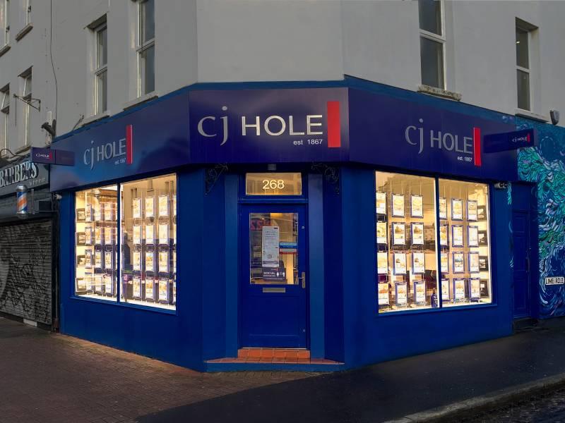 Exterior view of CJ Hole Southville estate agent office.