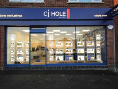 Exterior view of CJ Hole Downend estate agent office.