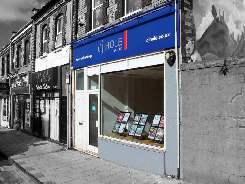 Exterior view of CJ Hole Redfield estate agent office.