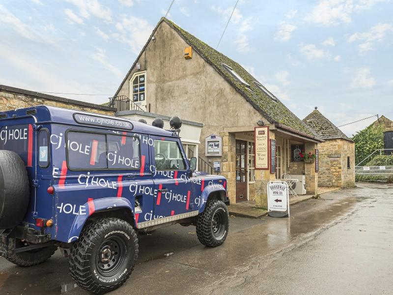 Exterior view of CJ Hole Broadway estate agent office.