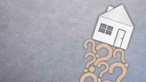 A house adorned with various question marks on its exterior.