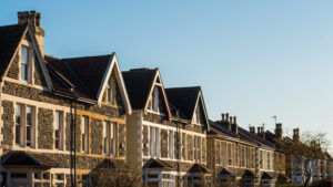 Terraced houses basking in sunlight on a clear day.