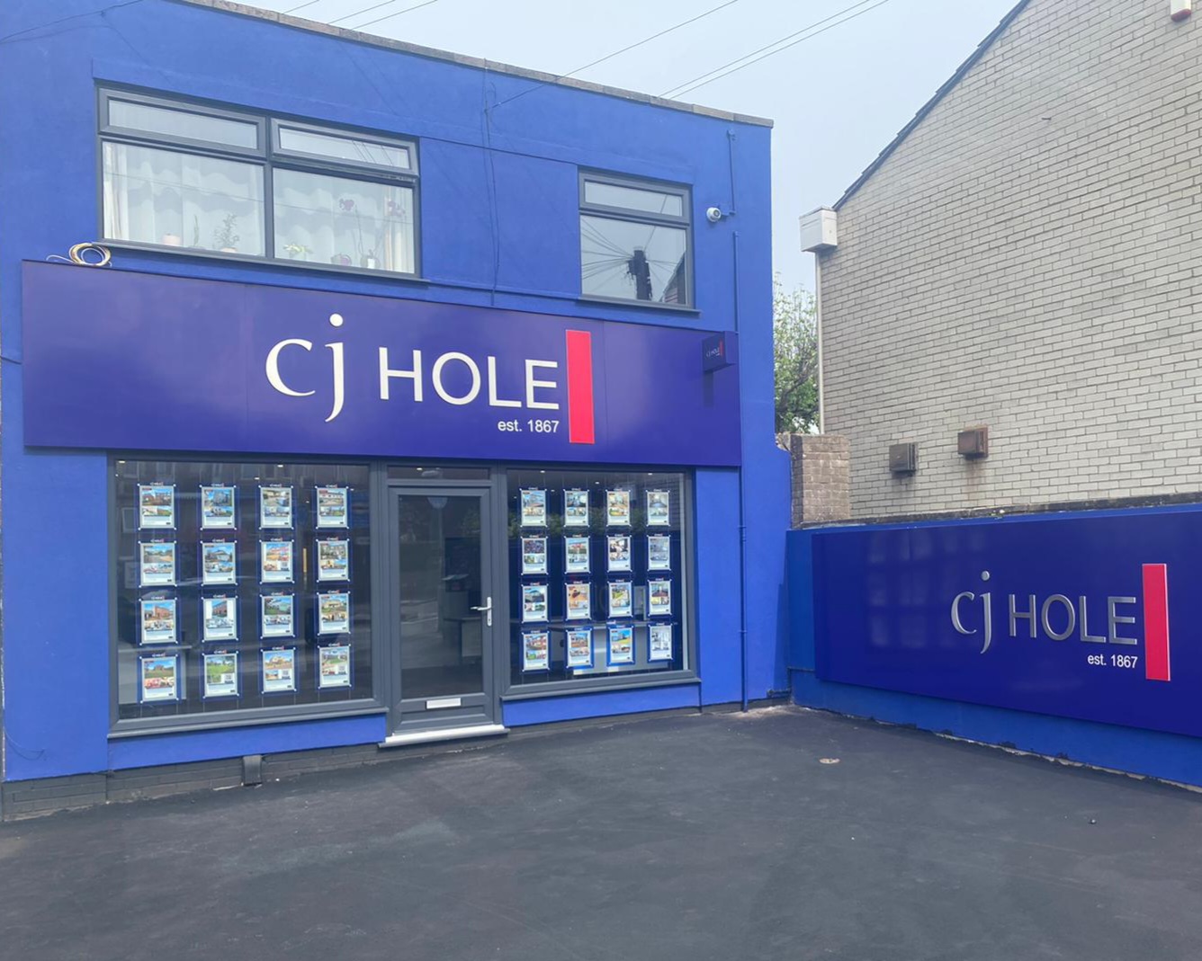 The Front of a Building With a Blue Facade in Bishopsworth Area
