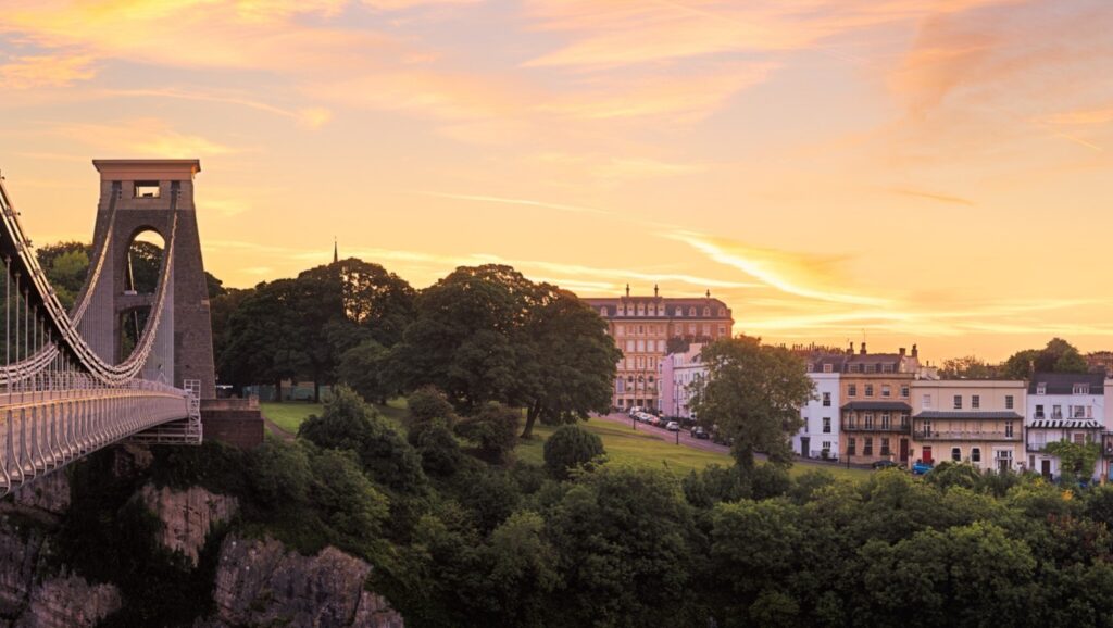 Clifton Suspension Bridge in Bristol, England, illuminated at sunset.
