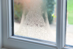 A window pane adorned with glistening water droplets.