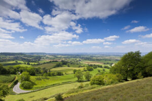 a view of the countryside from the top of a hill