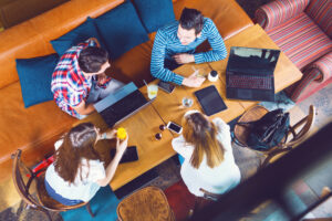 a group of people sitting around a table