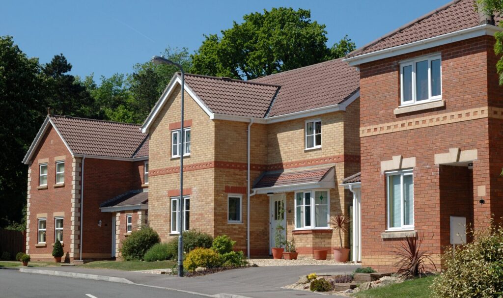Row of modern semi-detached and detached family homes in the South West, typical of properties in the £350k price range.