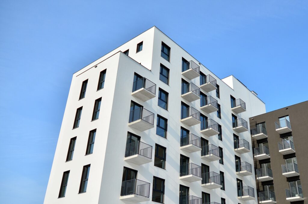 Modern apartment building featuring multiple balconies.