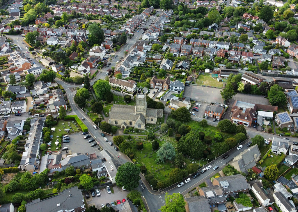 Aerial view of a quaint English town with charming architecture.