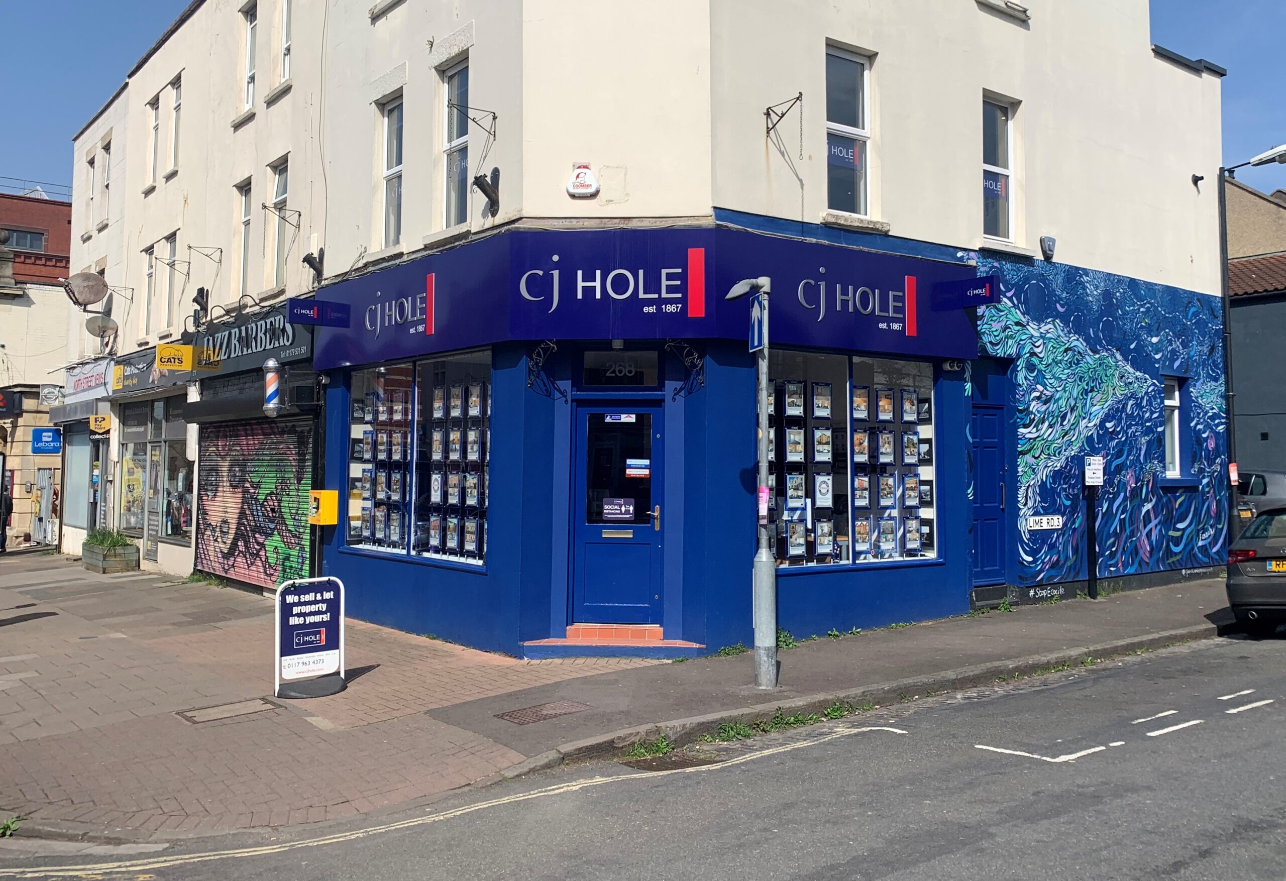 The Blue Building Is Painted With Graffiti