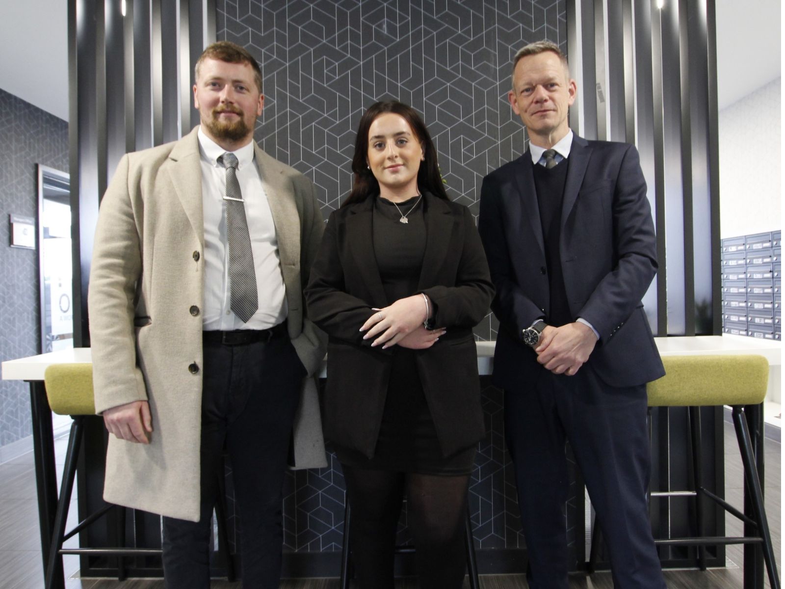 A group of estate agents posing inside CJ Hole Weston-super-Mare Office.