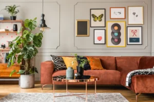 Living room featuring orange furniture and framed pictures on the wall.